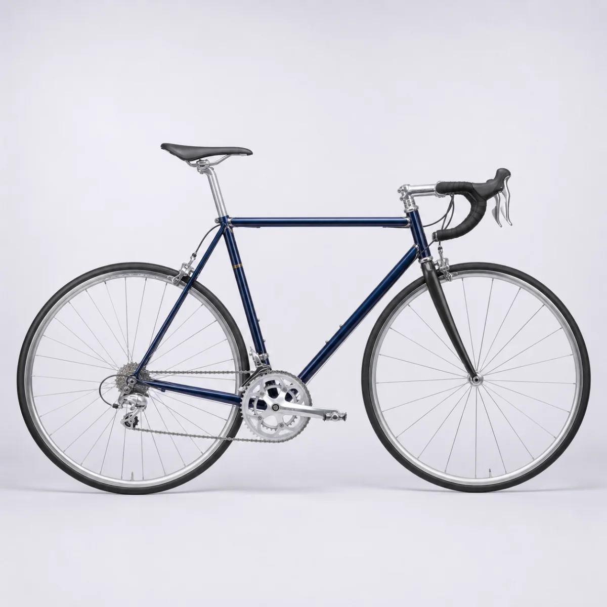 Corsa № 7: a navy steel road bicycle photographed in profile